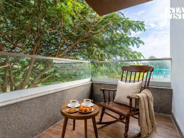 Photo 7 of 10 at Brickstone Villa by VEO, StayVista - 3BHK with Lake View & Shared Pool