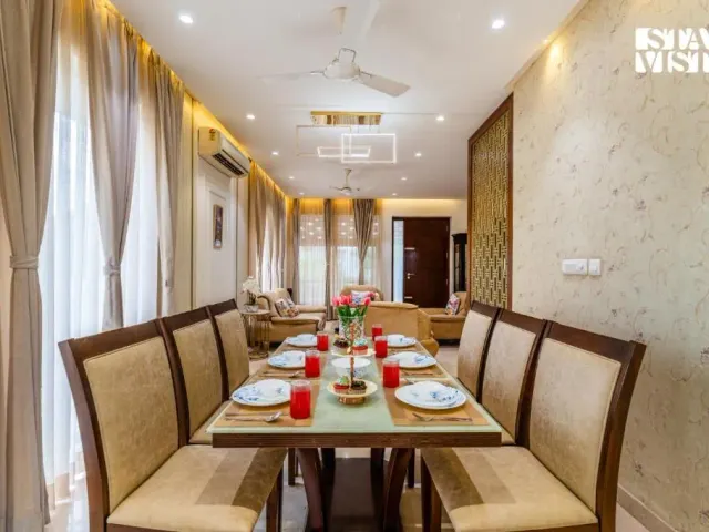 Photo 4 of 10 at Brickstone Villa by VEO, StayVista - 3BHK with Lake View & Shared Pool