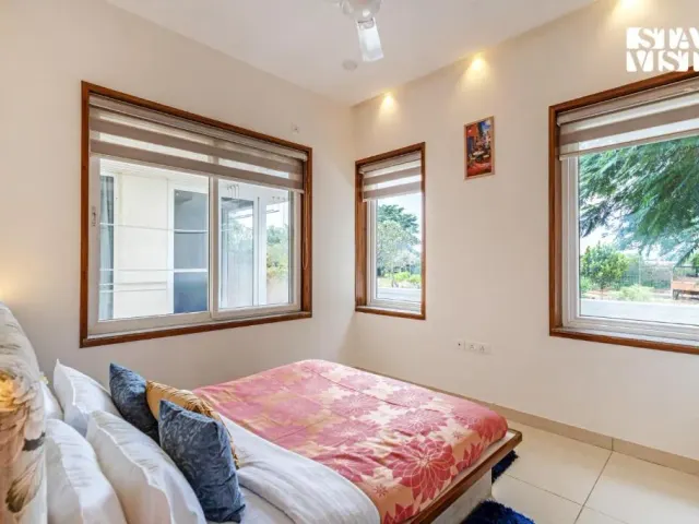 Photo 6 of 10 at Brickstone Villa by VEO, StayVista - 3BHK with Lake View & Shared Pool
