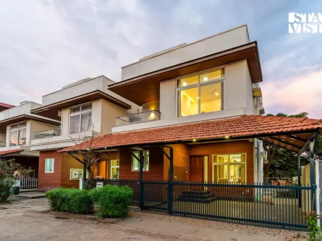 Photo 2 of 10 at Brickstone Villa by VEO, StayVista - 3BHK with Lake View & Shared Pool